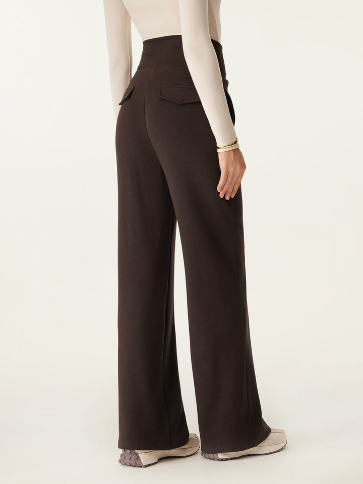 woman in wide waistband pintuck pants from back side view